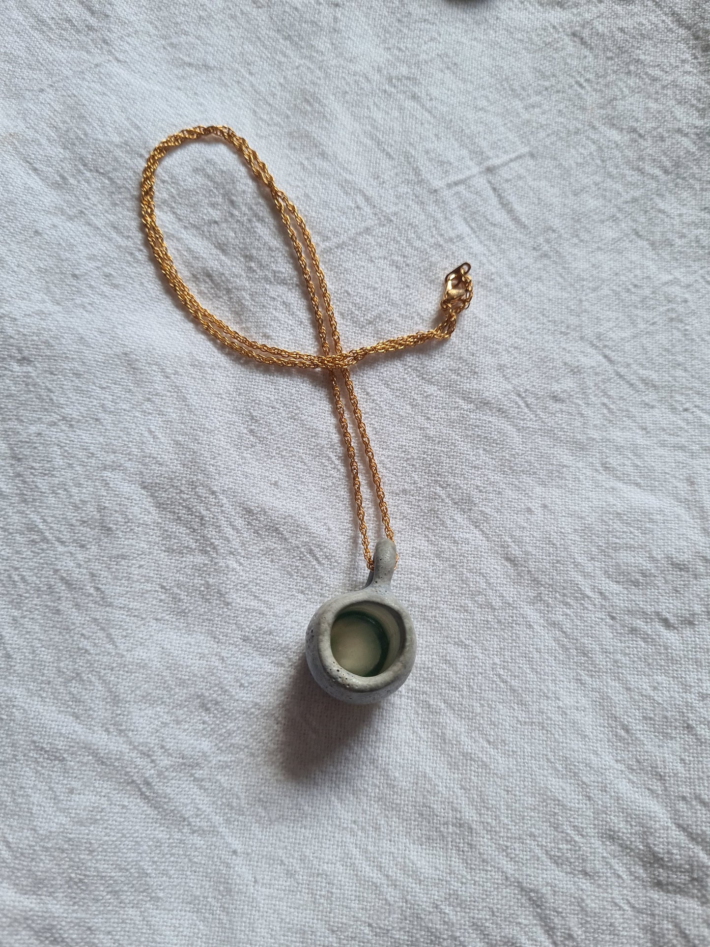 Cup, gold necklace