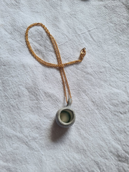Cup, gold necklace